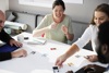 Four People Playing A Card Game