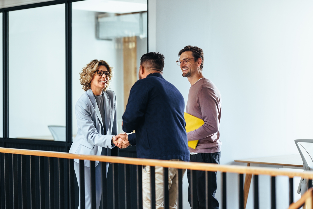 Business Woman Shaking Hands With A Client