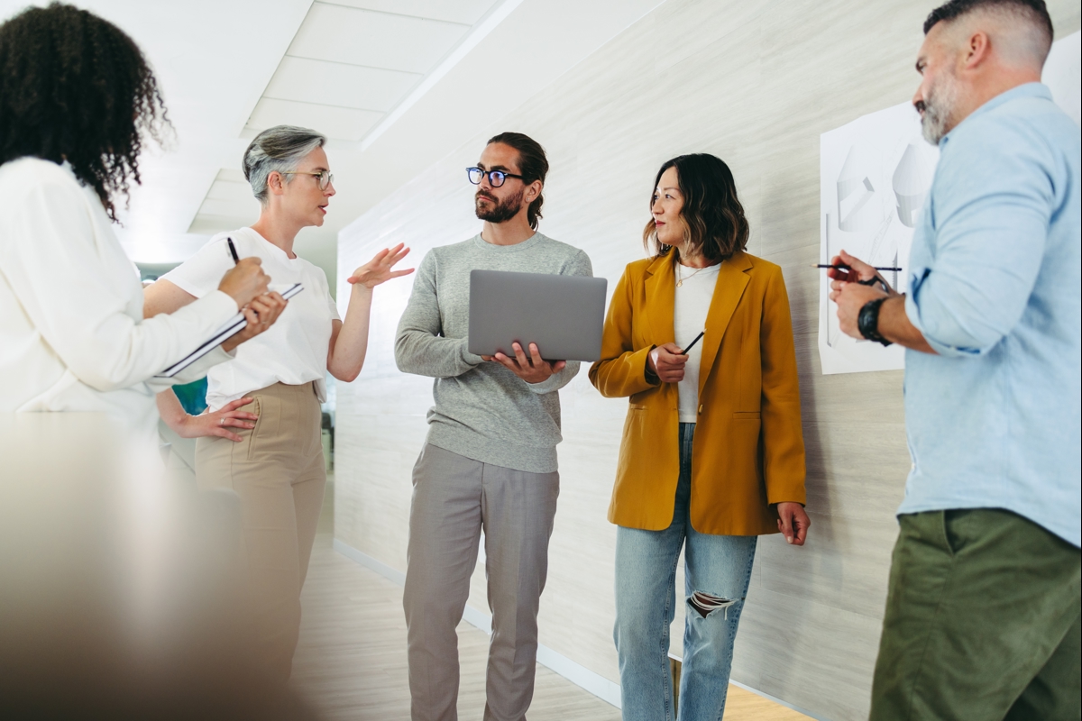 Professionals Standing Sharing Ideas