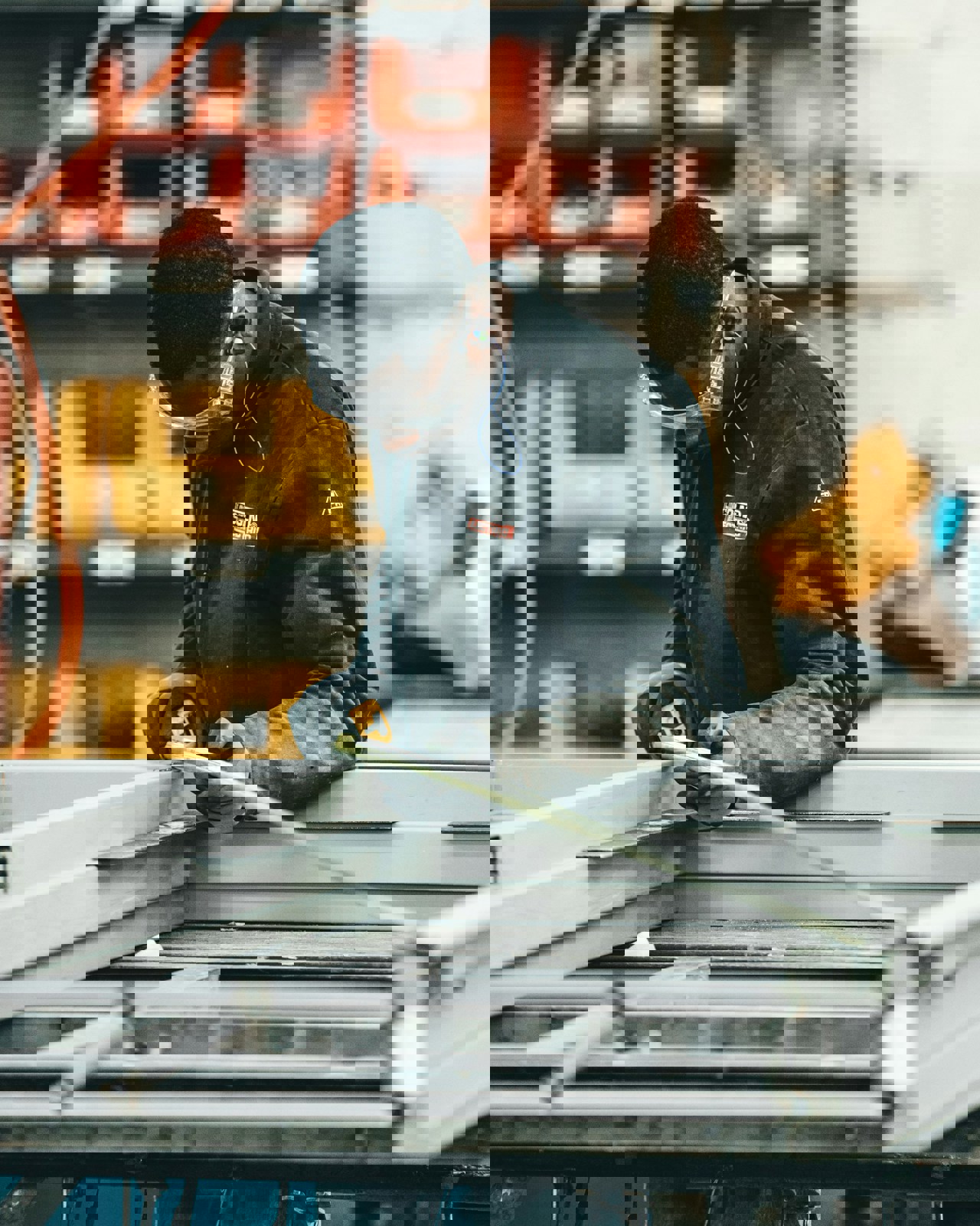 Man At Work With A Measuring Tape