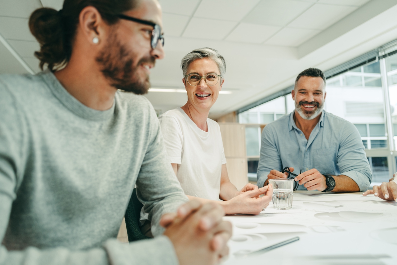 Cheerful Colleagues Smiling Happily During A Meeting