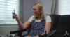 A Lady Smiling In A Wheelchair