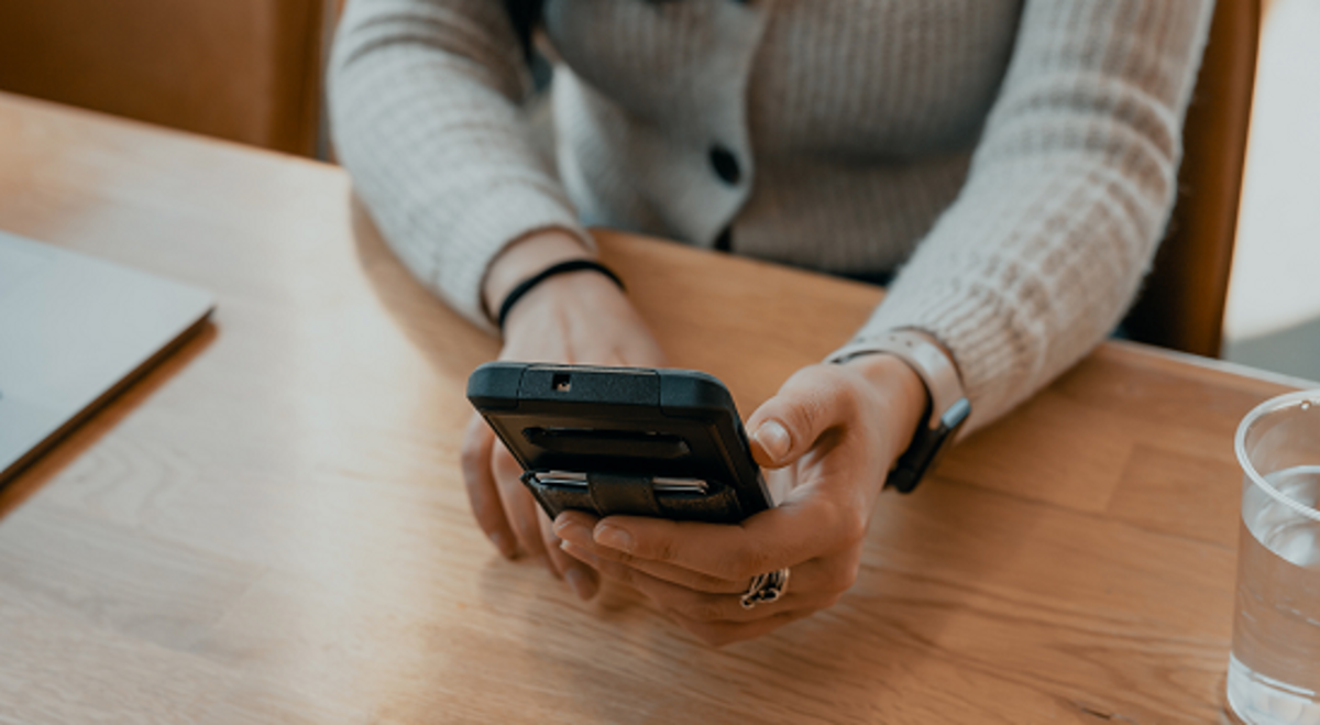 A Person Using A Mobile Phone