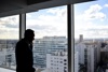A Man Looking Out A Window