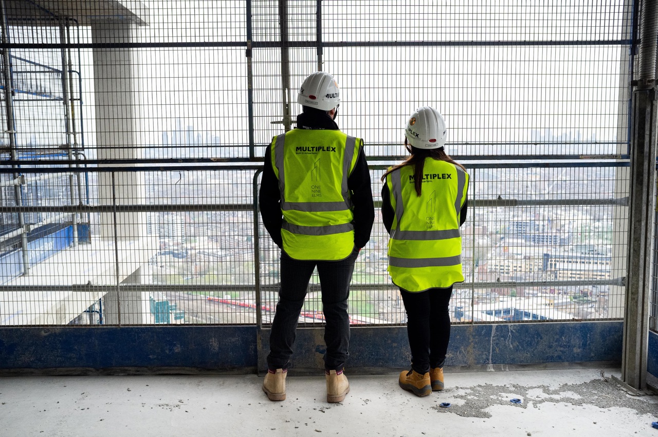 Two People In Construction Clothes On Site